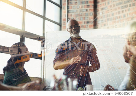 Mature businessman giving a presentation in the boardroom superimposed over railway tracks. Elderly man having a conference or workshop meeting over double exposure background. 94008507