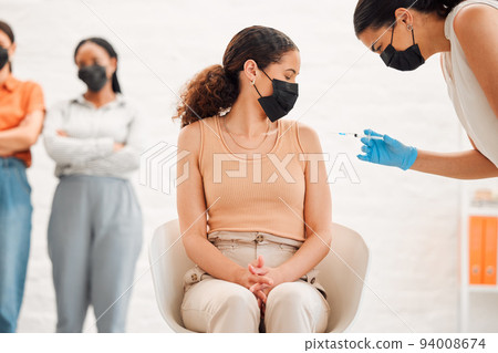 Covid, virus and vaccination line at clinic for needle vaccine shot. Public health and serious illness healthcare plan from government. Medicine, pandemic and injection from nurse for protection. 94008674