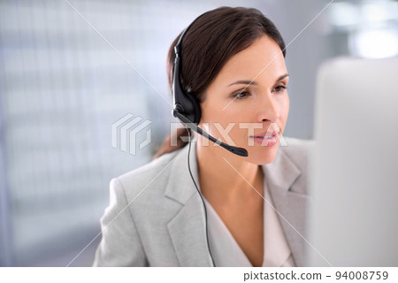Young female call center operator with headset, talking to caller in customer service department. Businesswoman in headphones with microphone consulting client on phone in office space. Young female call center operator with headset, talking to caller in customer service department. Businesswoman in headphones with microphone consulting client on phone in office space. 94008759