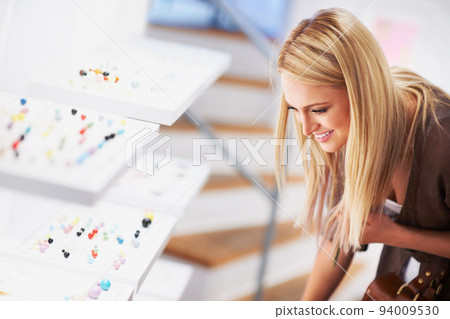 Shopping, retail and jewelry with a woman customer or consumer in a store, mall or shop with a choice of rings. Accessory, fashion and lifestyle with a happy female in a boutique or beauty outlet Shopping, retail and jewelry with a woman customer or consumer in a store, mall or shop with a choice of rings. Accessory, fashion and lifestyle with a happy female in a boutique or beauty outlet 94009530