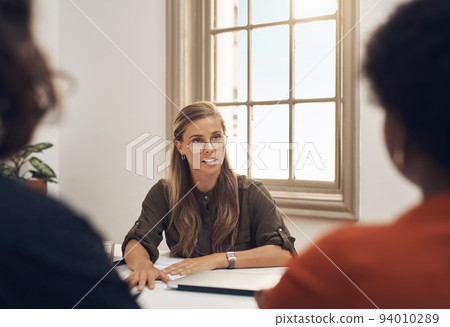 Human resources manager meeting with colleagues, settling a dispute or argument in her office. Serious female leader talking, meeting and planning with her team and staff members at work Human resources manager meeting with colleagues, settling a dispute or argument in her office. Serious female leader talking, meeting and planning with her team and staff members at work 94010289