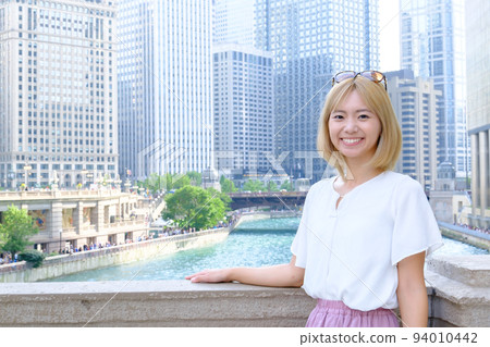 blonde woman traveling abroad 94010442