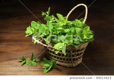Herb mint in a small basket 94013823
