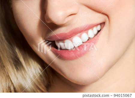 Perfect healthy teeth smile of a young woman. Teeth whitening. Dental clinic patient. Image symbolizes oral care dentistry, stomatology Perfect healthy teeth smile of a young woman. Teeth whitening. Dental clinic patient. Image symbolizes oral care dentistry, stomatology 94015067