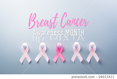 Pink ribbon on pastel paper background for supporting breast cancer awareness month campaign. 94015421