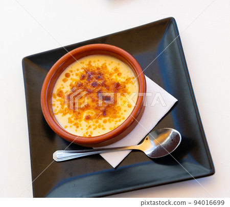 Catalan cream delicious dessert with sugar toast. Typical in Catalonia Spain Catalan cream delicious dessert with sugar toast. Typical in Catalonia Spain 94016699