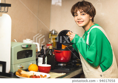 Young woman lifestyle cooking 94017058