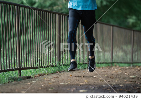 Feet of a man running Feet of a man running 94021439