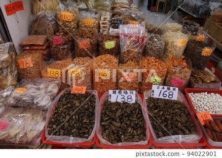 Dried oysters for sale at a dry goods store in Tokufu Dosai, Hong Kong. Dried scallops on top. The highest grade is made in Japan and is expensive Dried oysters for sale at a dry goods store in Tokufu Dosai, Hong Kong. Dried scallops on top. The highest grade is made in Japan and is expensive 94022901