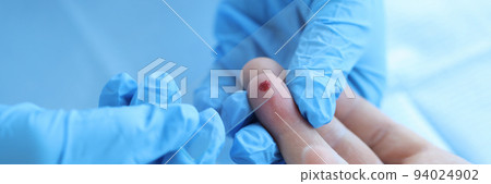 Doctor with blood sample on glass in laboratory closeup 94024902