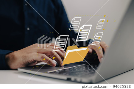 Uploading documents from folder. Open File folder with flying blank documents with laptop computer. Data transfer backup, File Sharing, Document Transferring concept. 94025558