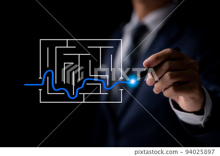 A businessman navigating a maze in a business solution concept. This symbol stands for genius, intelligence, opportunity, challenge, planning, and strategy. 94025897