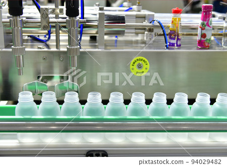 White plastic Bottles transfer on Automated conveyor systems industrial automation for package White plastic Bottles transfer on Automated conveyor systems industrial automation for package 94029482