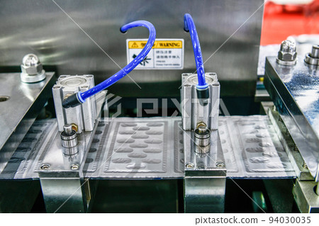 Aluminum foil blister pack packaging to protect from light in production line, Industrial pharmaceutical concept 94030035