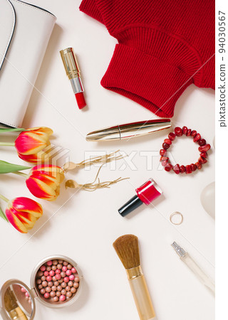 Stylish trending flat lay blogger for Valentine's Day. Red sweater, earrings, purse, bracelet, ring, lipstick, shoes and cosmetics. Top view Stylish trending flat lay blogger for Valentine's Day. Red sweater, earrings, purse, bracelet, ring, lipstick, shoes and cosmetics. Top view 94030567