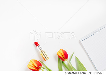 Valentines desktop background with red tulip, notebook, cosmetic. Valentine's Day greeting card. Female blogger workplace. Top view with copy space Valentines desktop background with red tulip, notebook, cosmetic. Valentine's Day greeting card. Female blogger workplace. Top view with copy space 94030569
