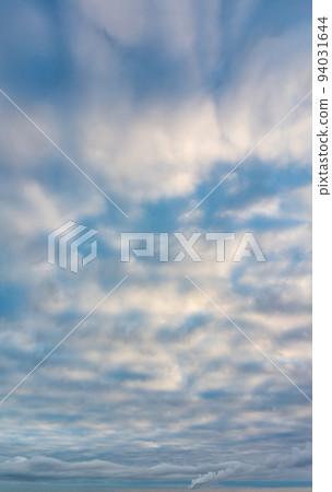 Fantastic clouds at sunrise, vertical panorama 94031644