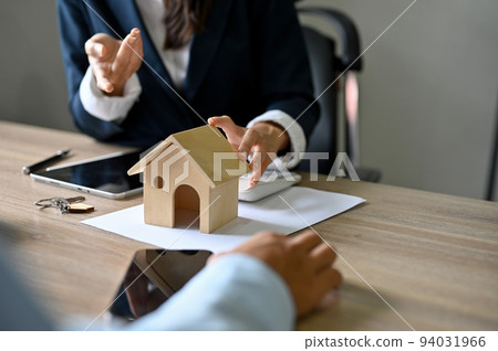 Female real estate agent or realtor broker meets with her client. cropped shot Female real estate agent or realtor broker meets with her client. cropped shot 94031966