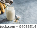 Banana protein smoothie in glass jar 94033514