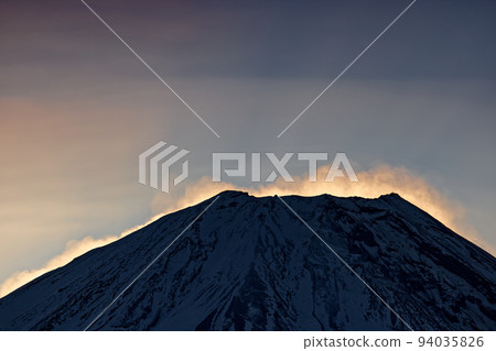 Mt. Fuji at dawn with snow smoke seen from Lake Honjo and Ryugatake Mt. Fuji at dawn with snow smoke seen from Lake Honjo and Ryugatake 94035826
