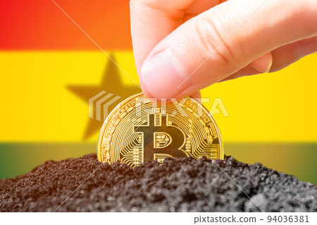 Legalization of bitcoins in Ghana. Planting a Bitcoin in the ground against the background of the flag of Ghana. Ghana - investment in cryptocurrency. Legalization of bitcoins in Ghana. Planting a Bitcoin in the ground against the background of the flag of Ghana. Ghana - investment in cryptocurrency. 94036381