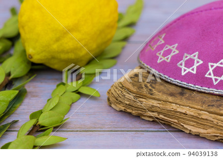 Sukkot is a Jewish holiday celebrated with the feast of Tabernacles with etrog ritual citrus fruit as part of its symbolism Sukkot is a Jewish holiday celebrated with the feast of Tabernacles with etrog ritual citrus fruit as part of its symbolism 94039138
