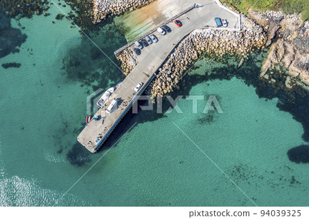 Aerial view of the pier at Leabgarrow on Arranmore Island in County Donegal, Republic of Ireland Aerial view of the pier at Leabgarrow on Arranmore Island in County Donegal, Republic of Ireland 94039325