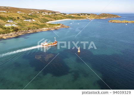 The red Arranmore ferry leaving the Island towards Burtonport, County Donegal, Ireland 94039329