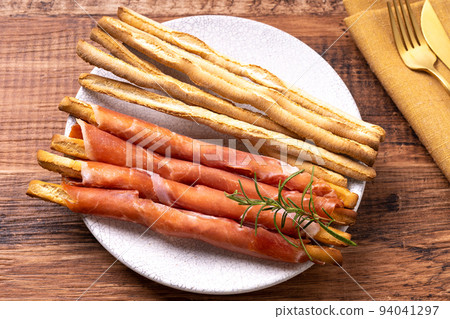 Grissini wrapped in prosciutto 94041297