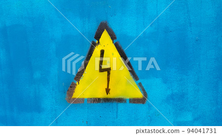 Bright yellow warning sign High voltage on blue Bright yellow warning sign High voltage on blue 94041731