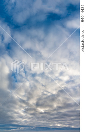 Fantastic clouds at sunrise, vertical panorama Fantastic clouds at sunrise, vertical panorama 94044425