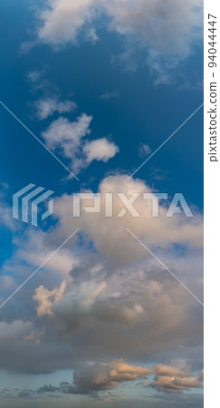 Fantastic clouds at sunrise, vertical panorama Fantastic clouds at sunrise, vertical panorama 94044447