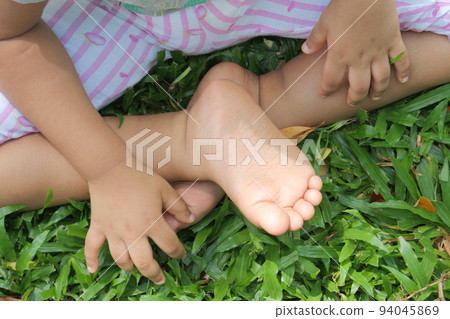 child girl suffering from itching skin, close up. 94045869