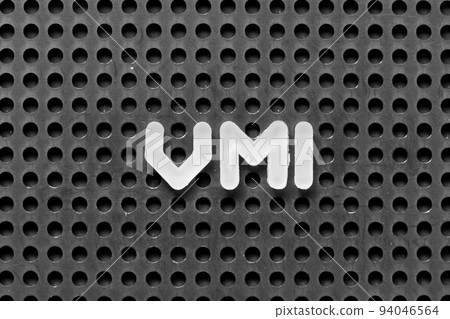 White alphabet letter in word VMI (abbreviation of vendor managed inventory) on black pegboard background 94046564