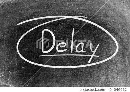 White chalk hand writing in word delay on blackboard background White chalk hand writing in word delay on blackboard background 94046612