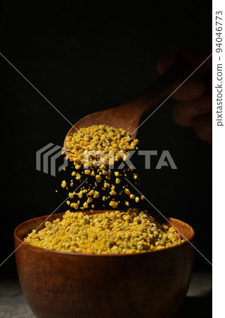 Raw Amorphous Pollen On A Wooden Spoon Raw Amorphous Pollen On A Wooden Spoon 94046773