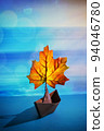 Paper Boat With A Maple Leaf On A Pond 94046780
