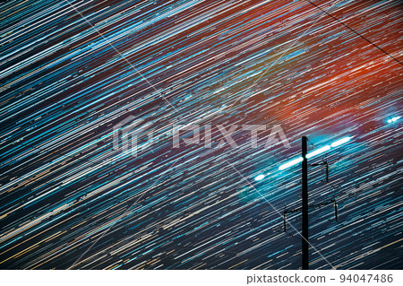Unusual Amazing Effects In Sky. Bright Night Starry Sky Background. Trails Of Stars Rotate Above Power Line. Large Exposure. Imagination, Fantasy, Illusion, Dream View. Flight Of Fancy Unusual Amazing Effects In Sky. Bright Night Starry Sky Background. Trails Of Stars Rotate Above Power Line. Large Exposure. Imagination, Fantasy, Illusion, Dream View. Flight Of Fancy 94047486