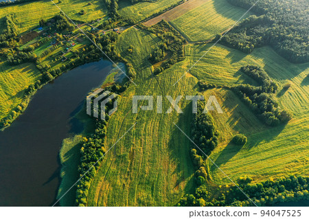 Lyepyel District, Vitebsk Region, Belarus. Aerial View Of Residential Area With Houses In Countryside. Sunny Autumn Morning. Sun Shining Above Town Skyline And Lepel Lake. Flat View 94047525