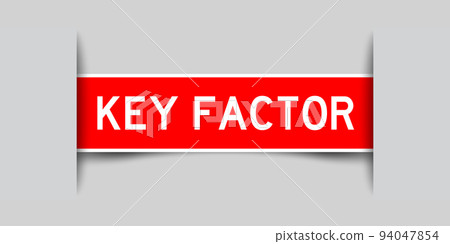 Inserted red color label sticker with word key factor on gray background 94047854