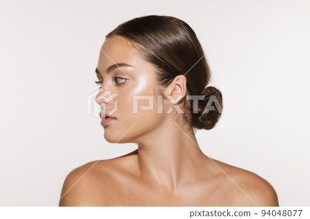 Portrait of young, beautiful and healthy girl with well-kept skin isolated on white background. The spa, surgery, face lifting and skin care concept Portrait of young, beautiful and healthy girl with well-kept skin isolated on white background. The spa, surgery, face lifting and skin care concept 94048077