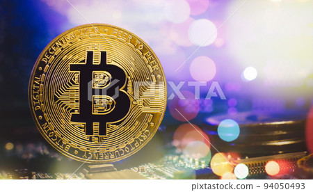Cryptocurrency concept , Golden bitcoin on mainboard , The future of money. Computational equipment. Cryptocurrency concept , Golden bitcoin on mainboard , The future of money. Computational equipment. 94050493