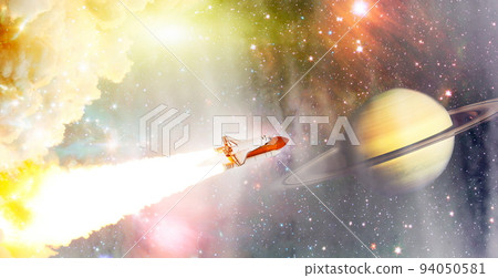 Spaceship flight. Starry sky and blue galactics. View on space shuttle and milky way. Elements of this image furnished by NASA Spaceship flight. Starry sky and blue galactics. View on space shuttle and milky way. Elements of this image furnished by NASA 94050581