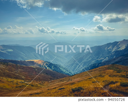 Mountain valley canyon landscape under blue sky. Wonderful autumn scene with orange grass. Beautiful nature background. Vintage retro tone. Travel, hiking, climbing, tourism. Carpathian mountains Mountain valley canyon landscape under blue sky. Wonderful autumn scene with orange grass. Beautiful nature background. Vintage retro tone. Travel, hiking, climbing, tourism. Carpathian mountains 94050726
