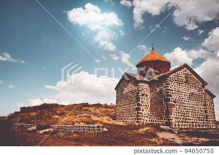 Ancient chapel in Armenia. Tourism and traveling destination. Old stone church of S. Karapet part of the Sevanavank monastery, Lake Sevan. Best famous travel location. Retro vintage orange tone filter Ancient chapel in Armenia. Tourism and traveling destination. Old stone church of S. Karapet part of the Sevanavank monastery, Lake Sevan. Best famous travel location. Retro vintage orange tone filter 94050758