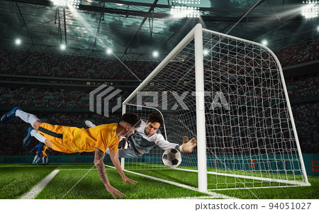 Football action in attack with striker trying to score at the goalkeeper Football action in attack with striker trying to score at the goalkeeper 94051027