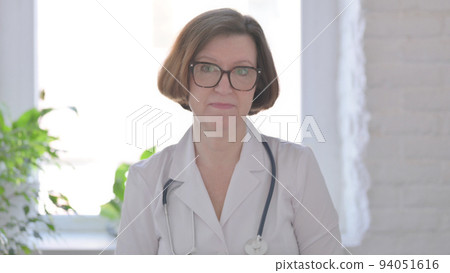 Senior Female Doctor Talking on Online Video Call 94051616