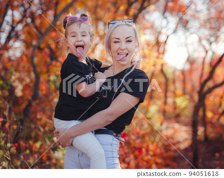 Beautiful young happy mother with little girl. 94051618