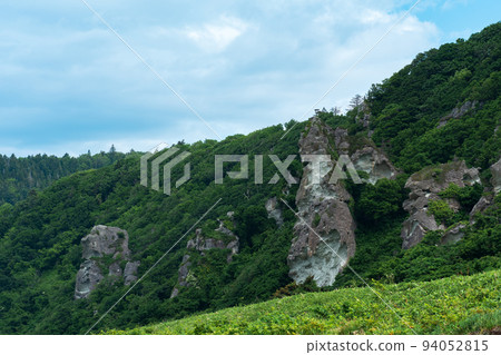 coastal landscape, beautiful lava rocks on the wooded coast of Kunashir island coastal landscape, beautiful lava rocks on the wooded coast of Kunashir island 94052815