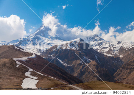 Mount Kazbek on a sunny day, Georgia Mount Kazbek on a sunny day, Georgia 94052834